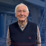 A picture of Hans Kringstad with a blue background.